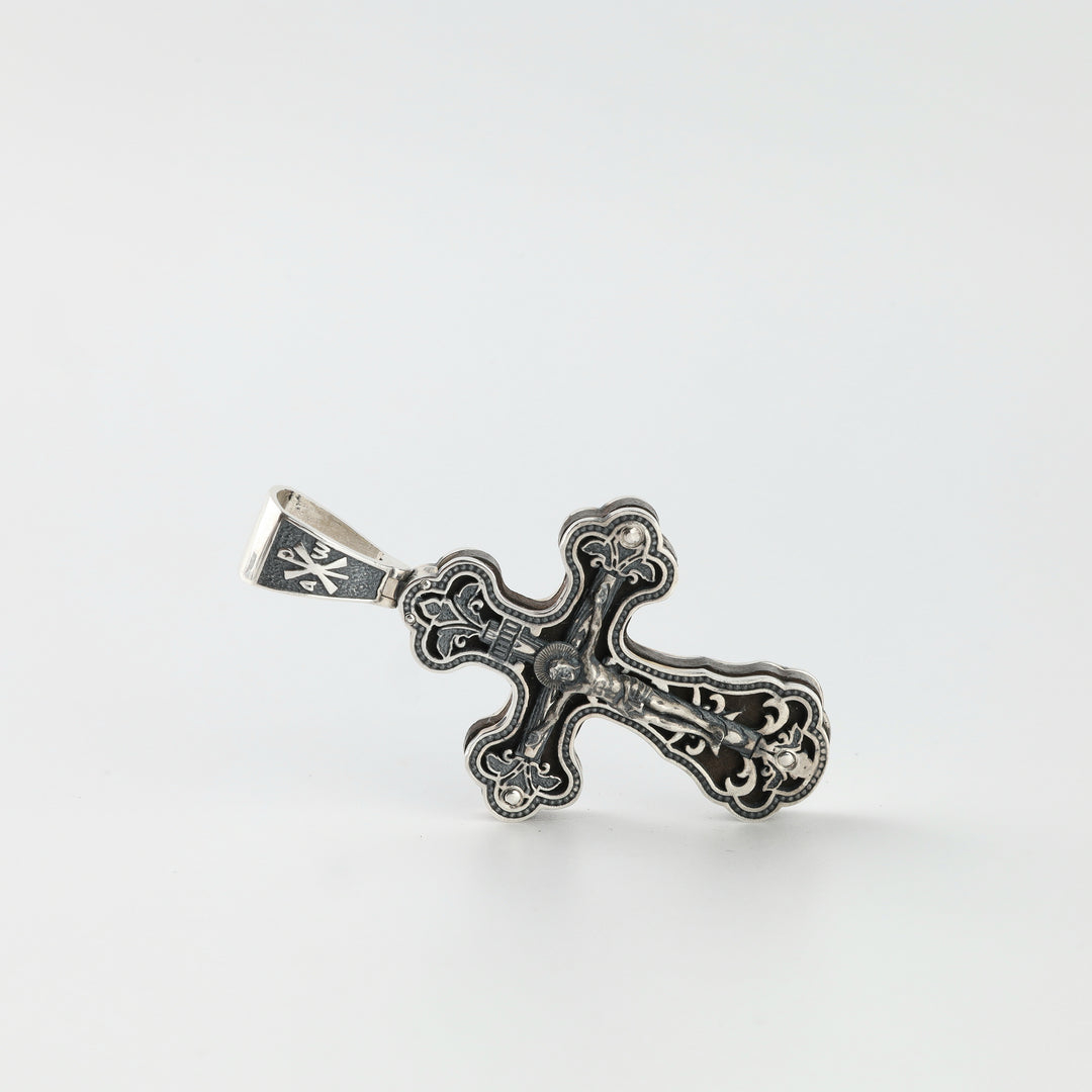 Orthodox silver cross pendant with ebony wood inlay, angled view