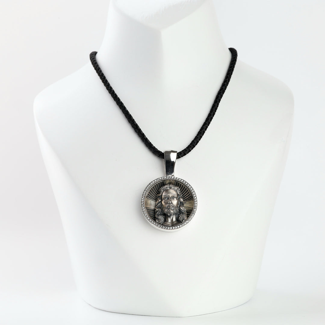Silver 925 Jesus Christ round medallion pendant with cubic zirconia on a black cord