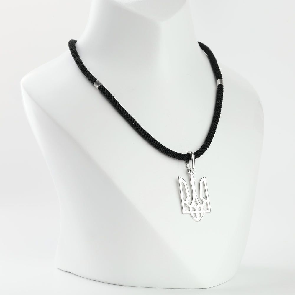 Silver 925 openwork trident pendant on a cord, angle view