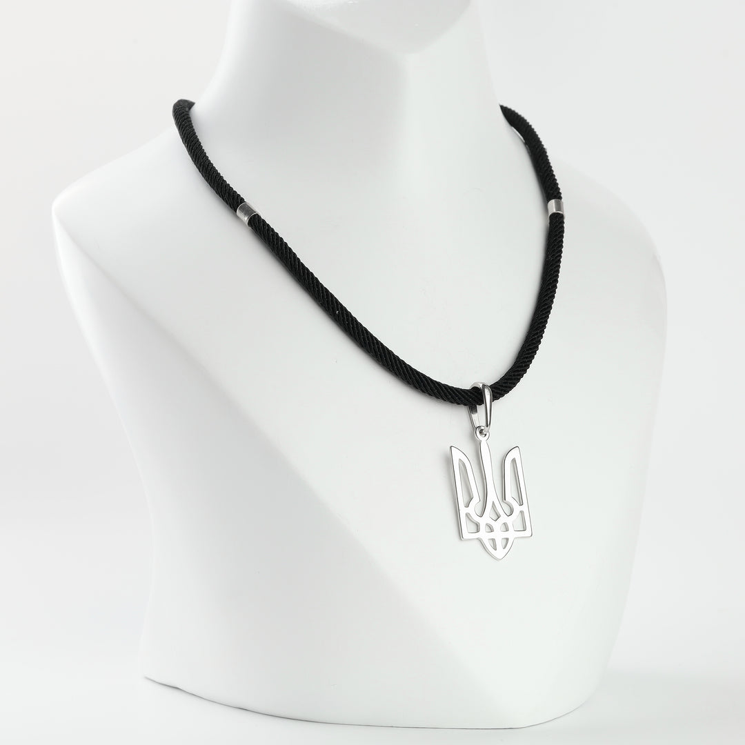 Silver 925 openwork trident pendant on a cord, angle view