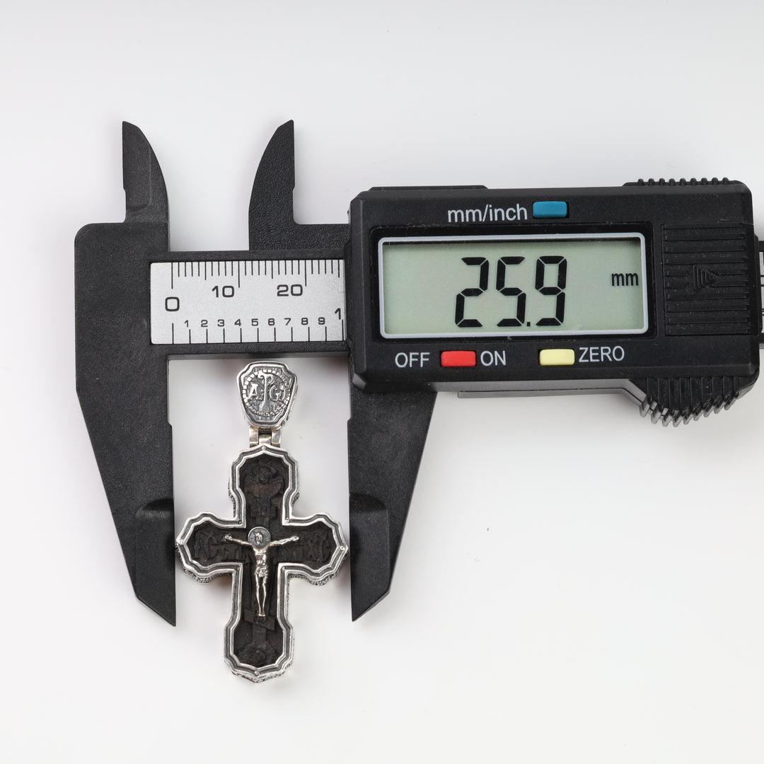 Silver and ebony cross pendant width measured with a caliper at 25.9 mm