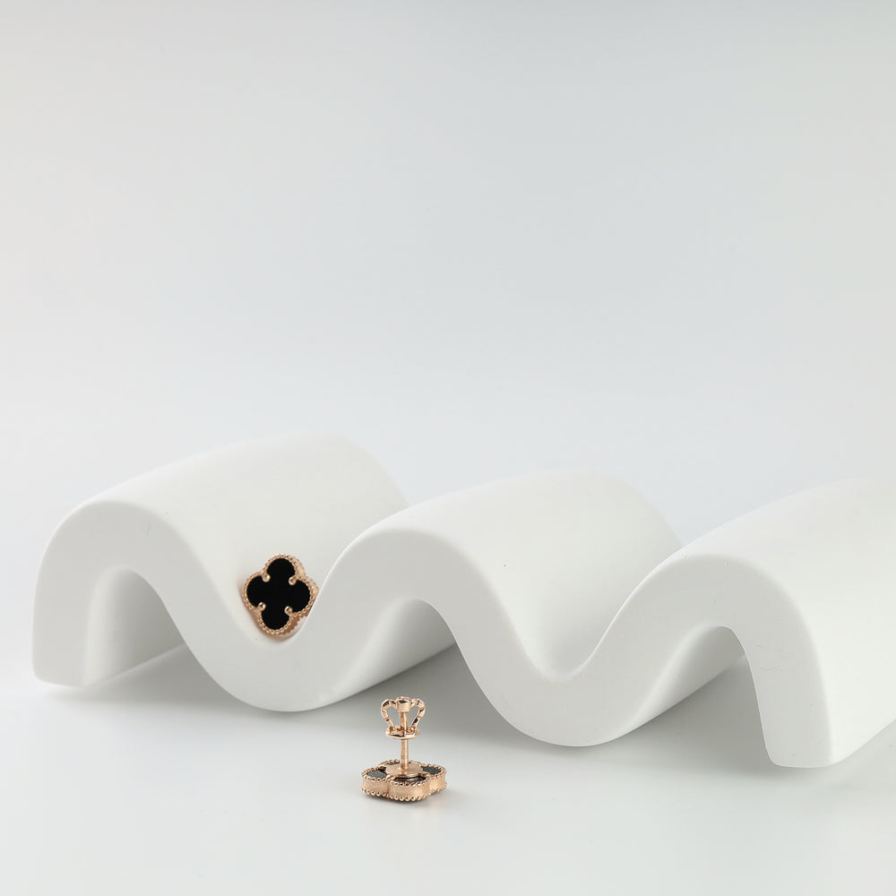 Pair of 14K rose gold clover stud earrings with black onyx inlay