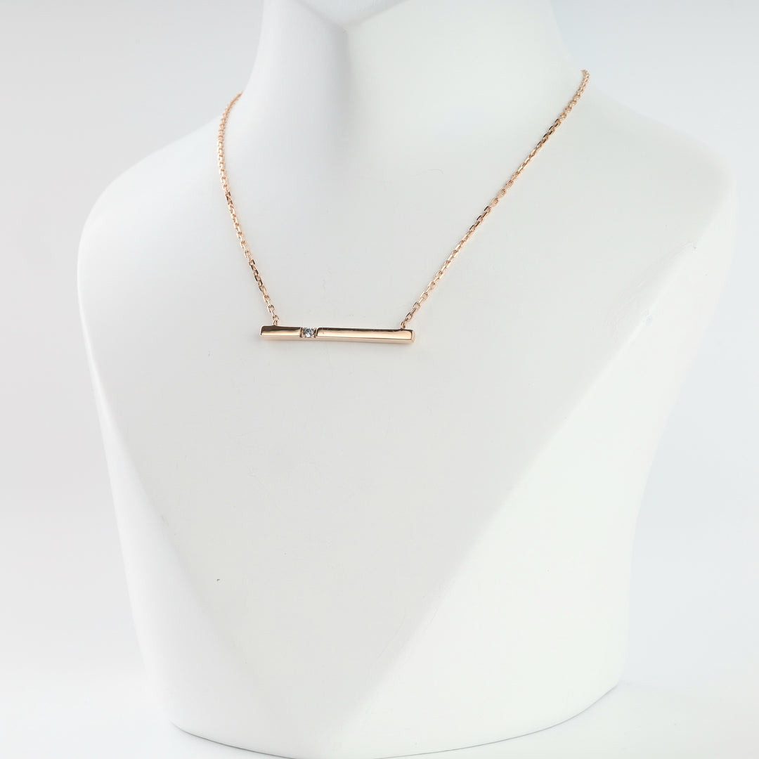Rose gold bar pendant necklace on a fine cable chain