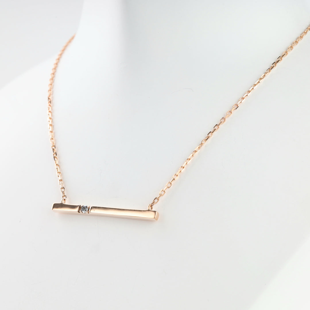Rose gold bar element with cubic zirconia, detail