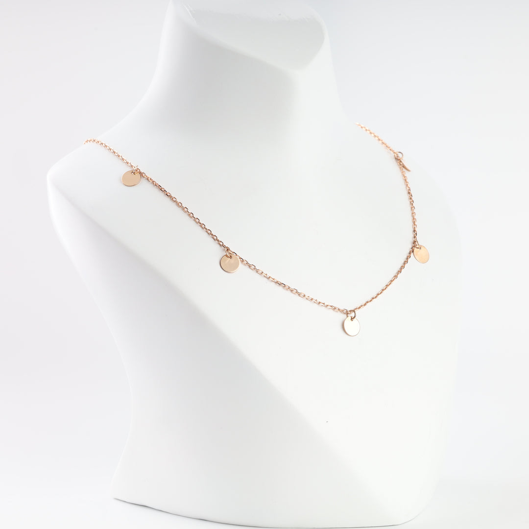 Rose gold disc drop necklace close-up
