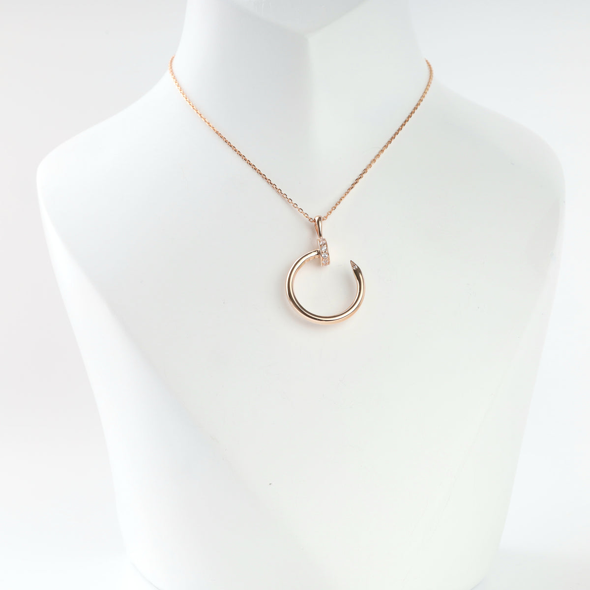 14K rose gold nail circle pendant with cubic zirconia on a chain