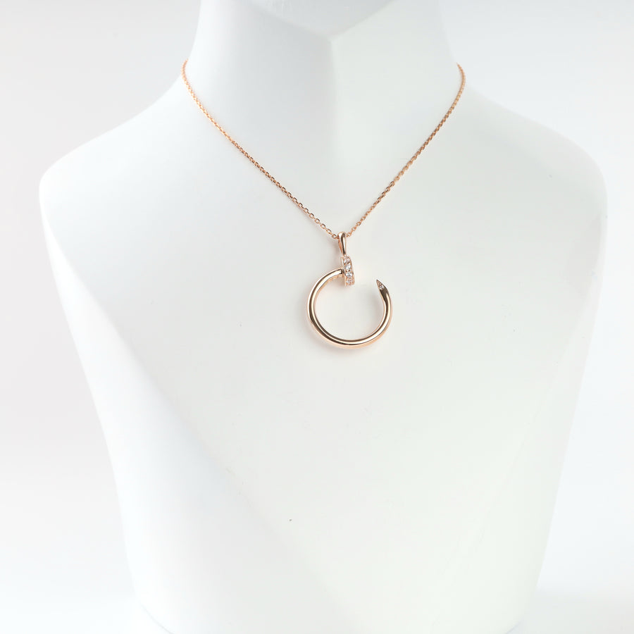 14K rose gold nail circle pendant with cubic zirconia on a chain