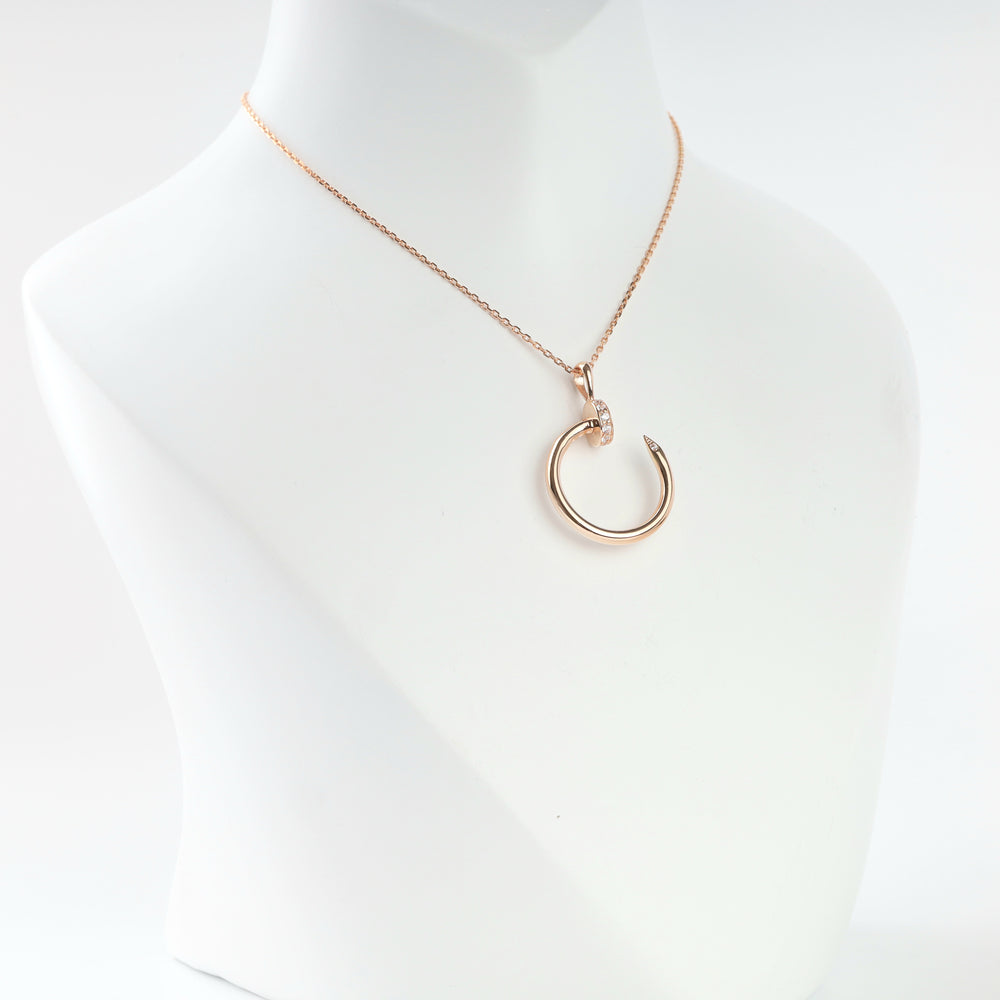 Rose gold 585 bent nail pendant with cubic zirconia, front view