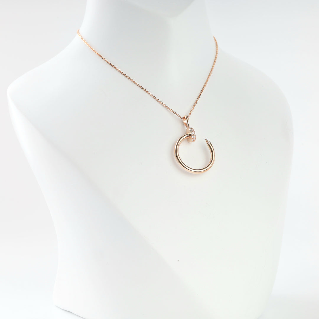 Rose gold 585 bent nail pendant with cubic zirconia, front view