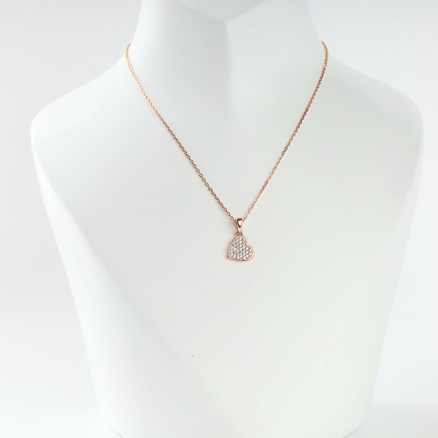 14K rose gold heart pendant with pave cubic zirconia on a chain