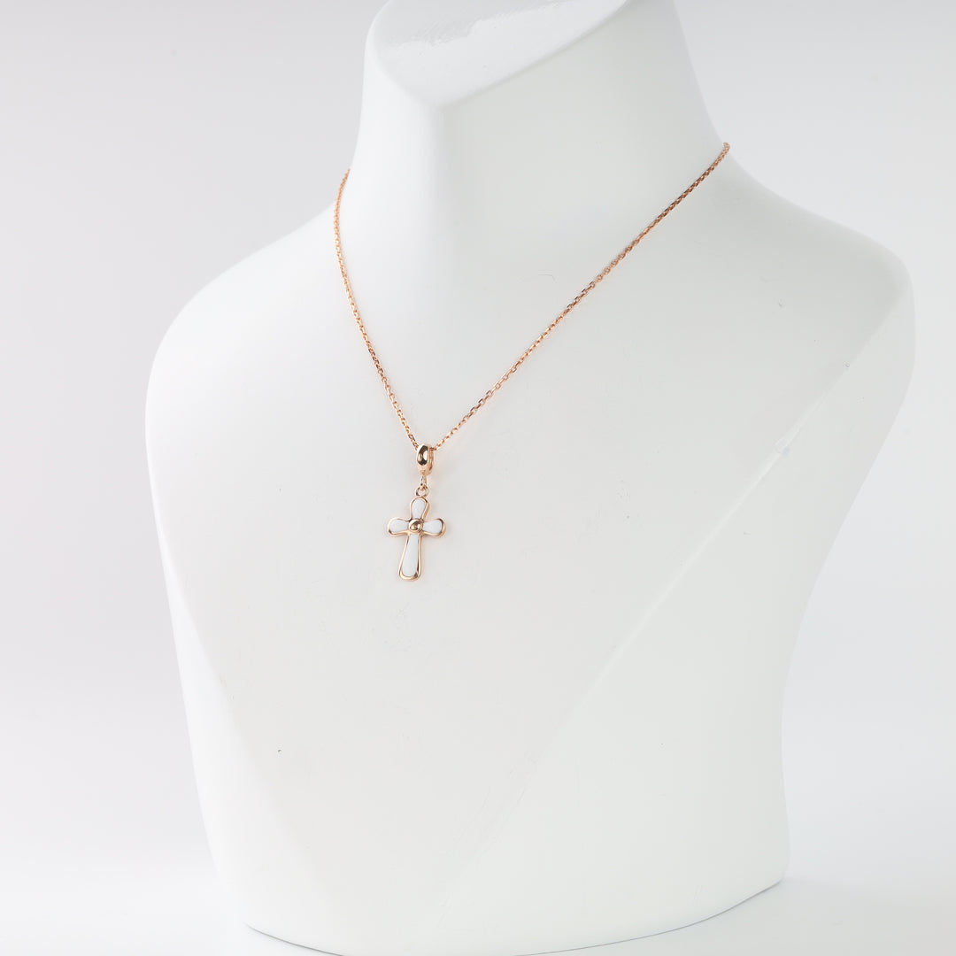 Rose gold cross pendant with white enamel and central bead
