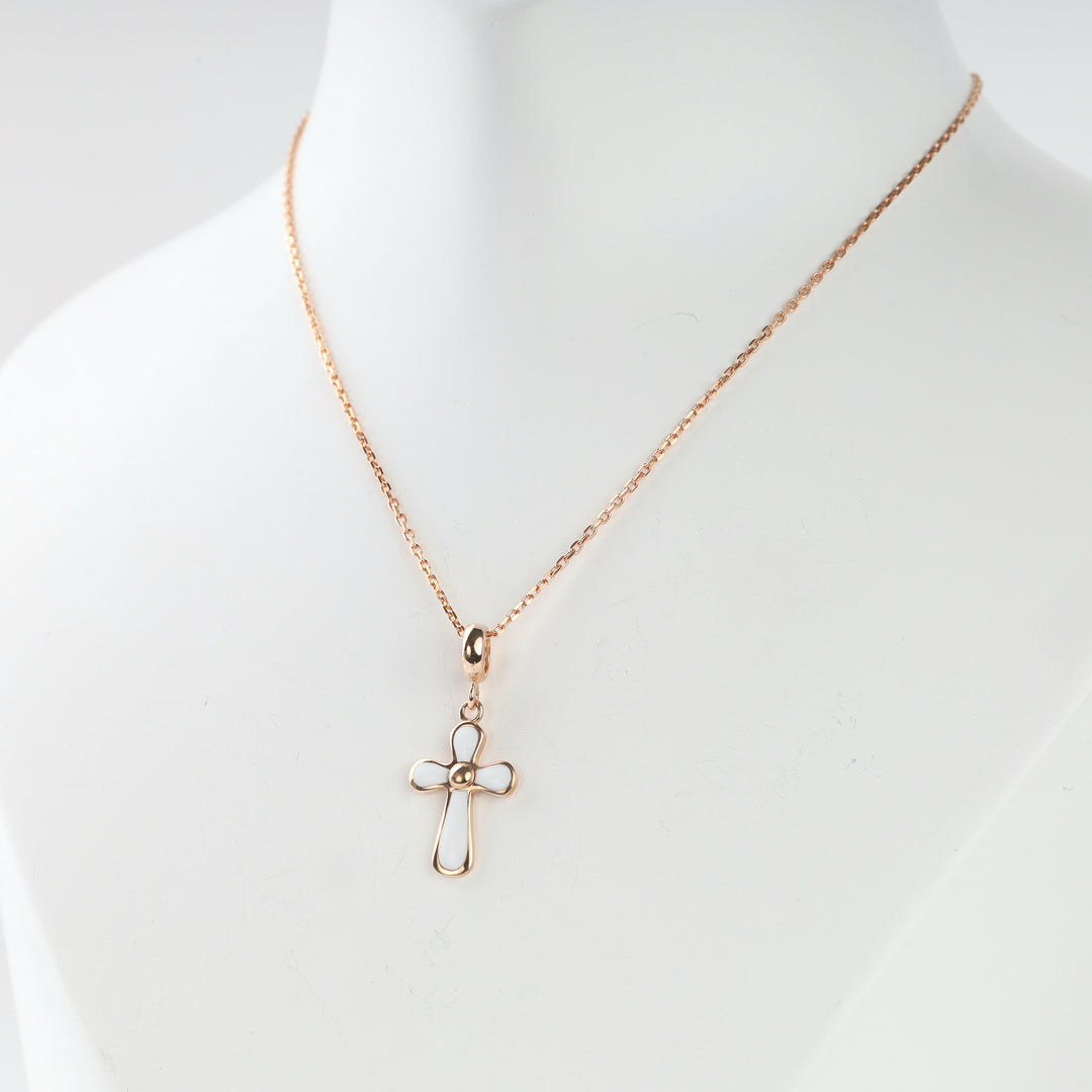 Rose gold 585 cross pendant with white enamel arms, front view
