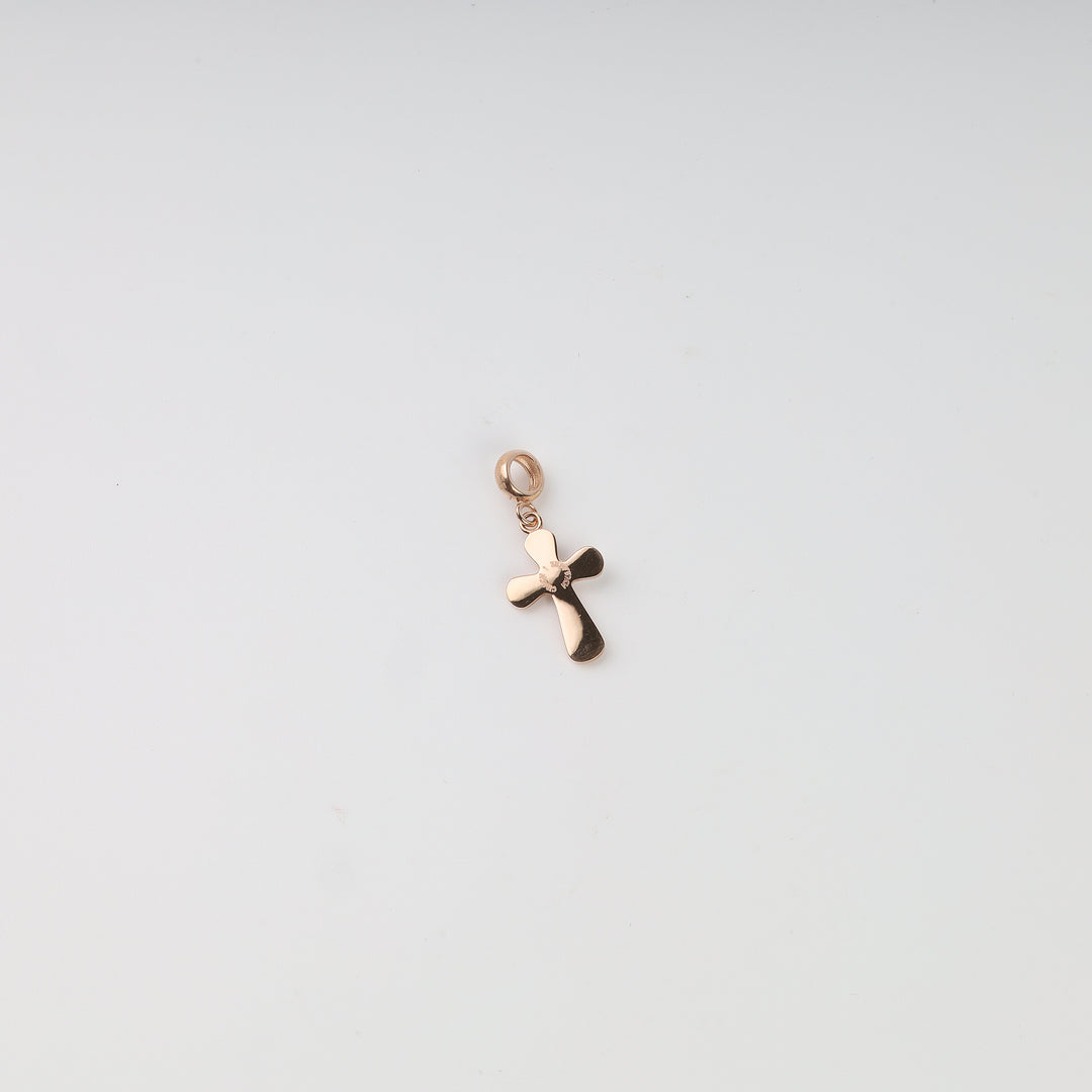 Rose gold cross pendant with rounded arms and white enamel