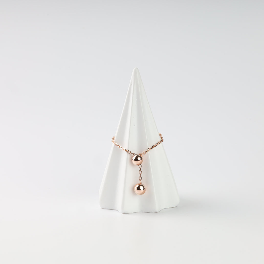 14K (585) rose gold ball chain ring on a white jewelry stand