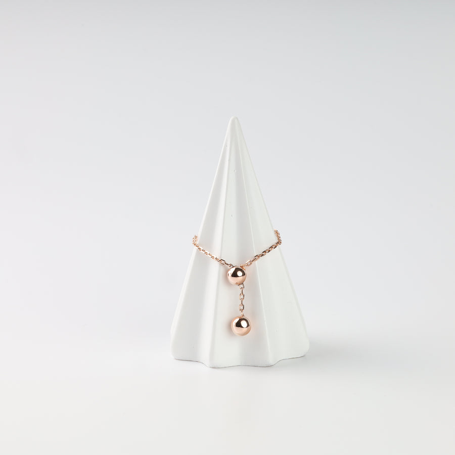 14K (585) rose gold ball chain ring on a white jewelry stand