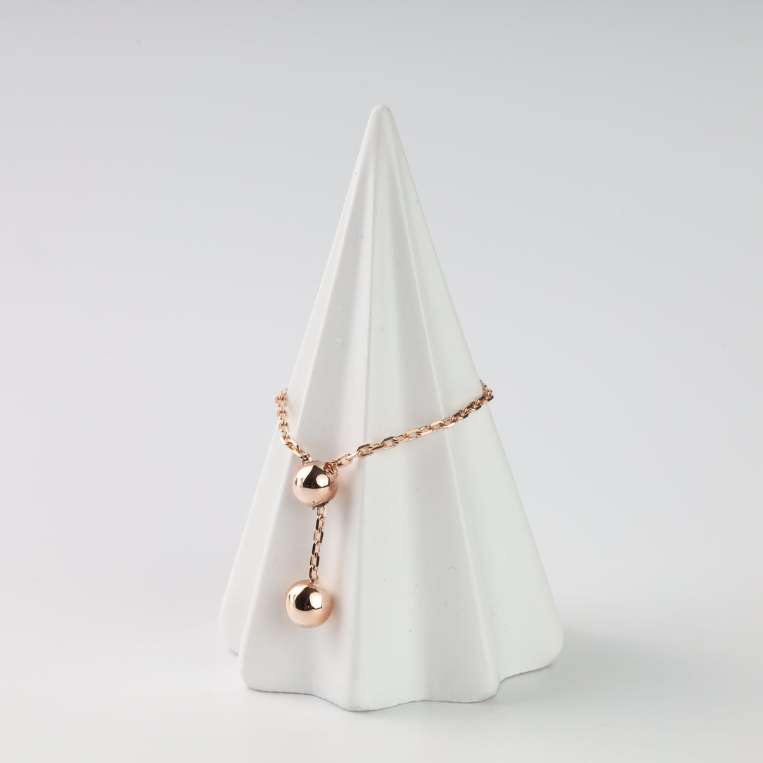 Rose gold chain ring with two polished ball details
