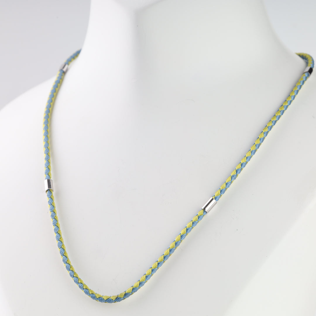 Blue and yellow cord styled on a display with Tryzub pendant, pendant not included