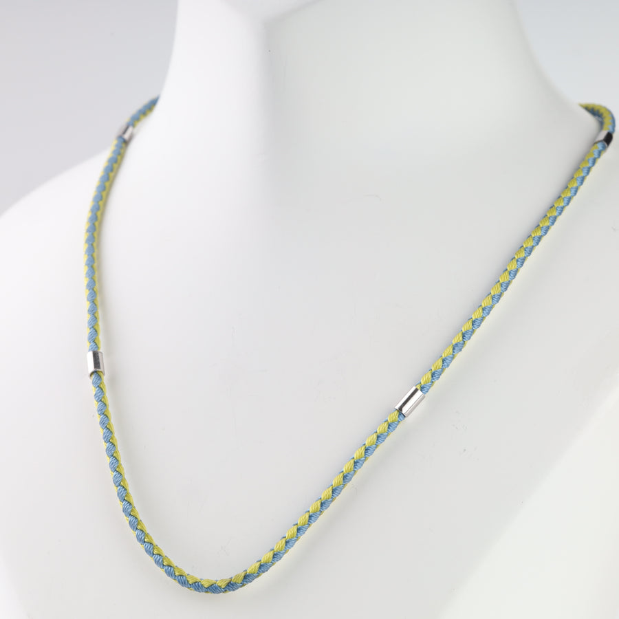 Blue and yellow cord styled on a display with Tryzub pendant, pendant not included