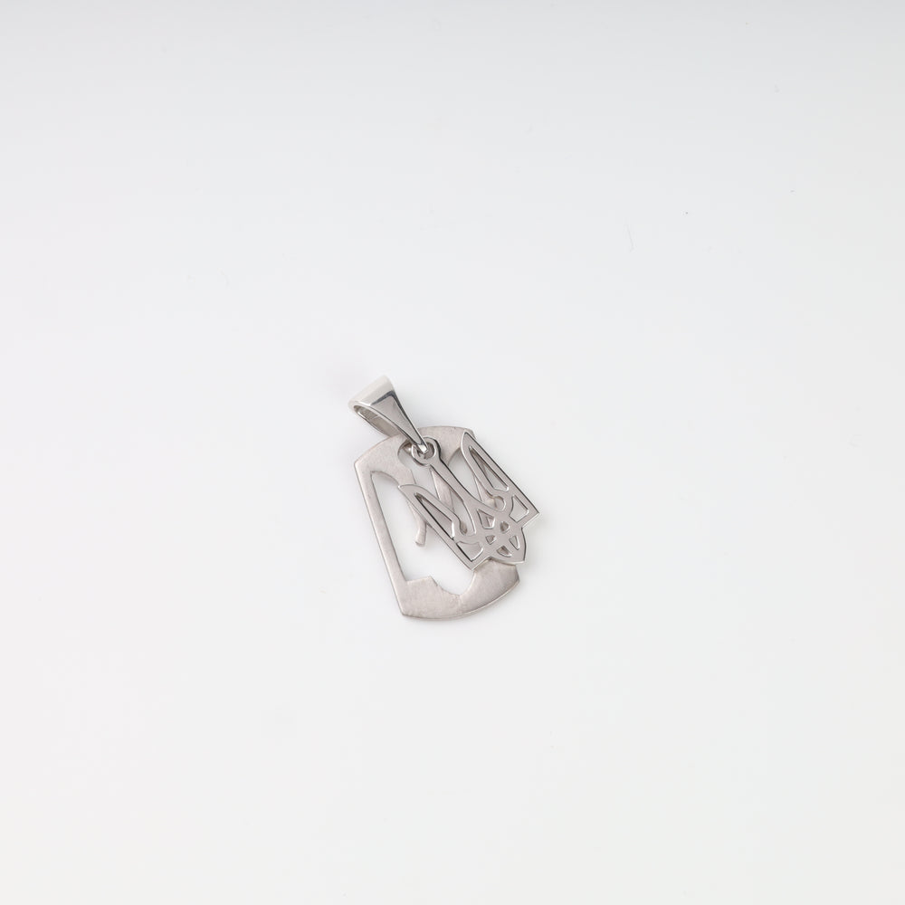 Angled view showing the openwork construction and satin surface of the silver Tryzub tag pendant
