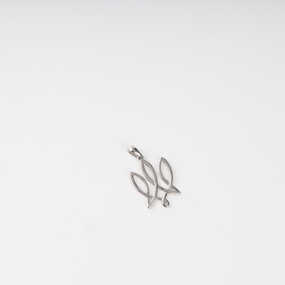 Angled view of the openwork construction and polished surface of the silver Tryzub pendant