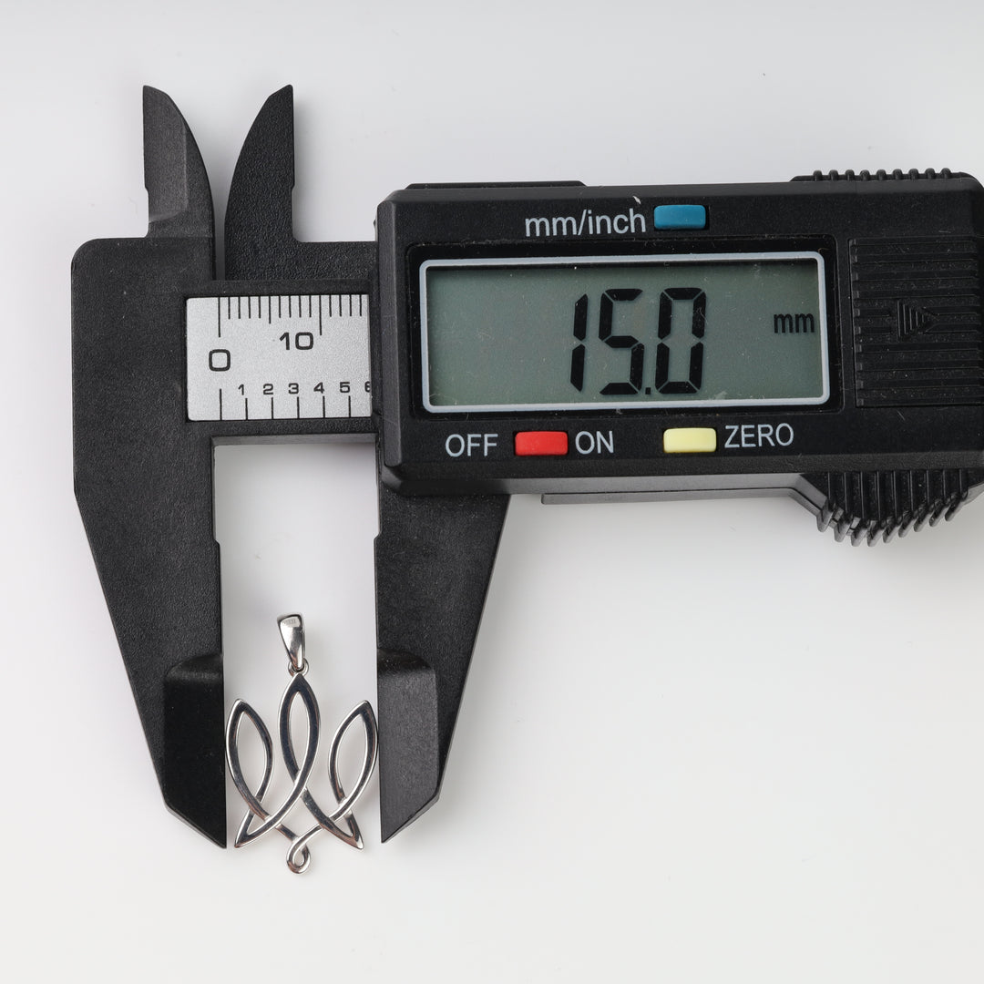 Second caliper check measuring the silver Tryzub pendant width at 15.0 mm