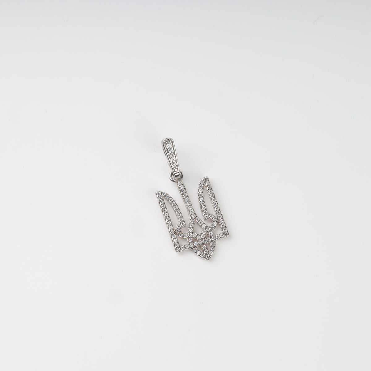 Front view of the silver 925 openwork Ukrainian Tryzub pendant covered with pavé-set clear stones