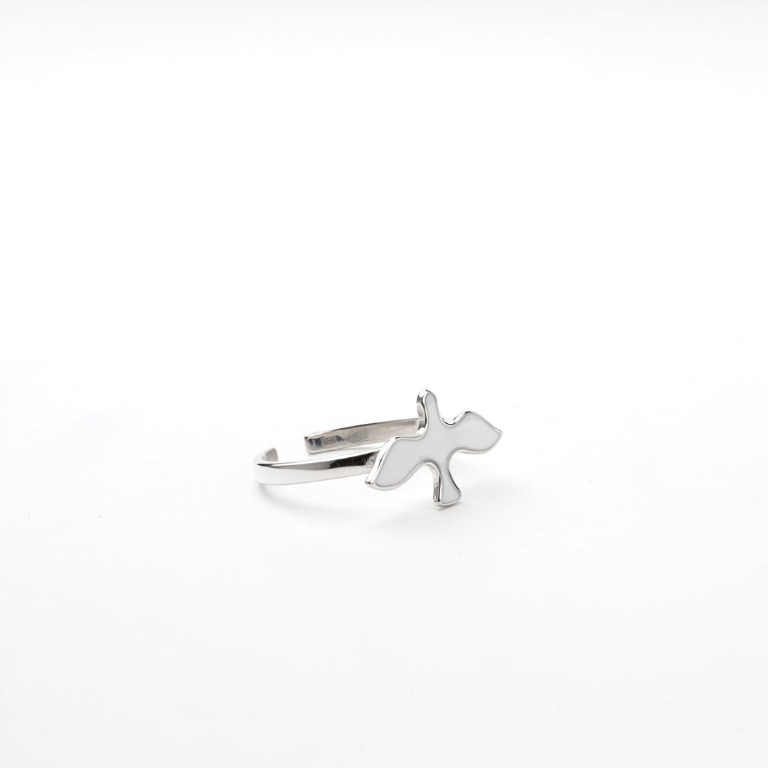 Silver bird ring standing upright showing the open band
