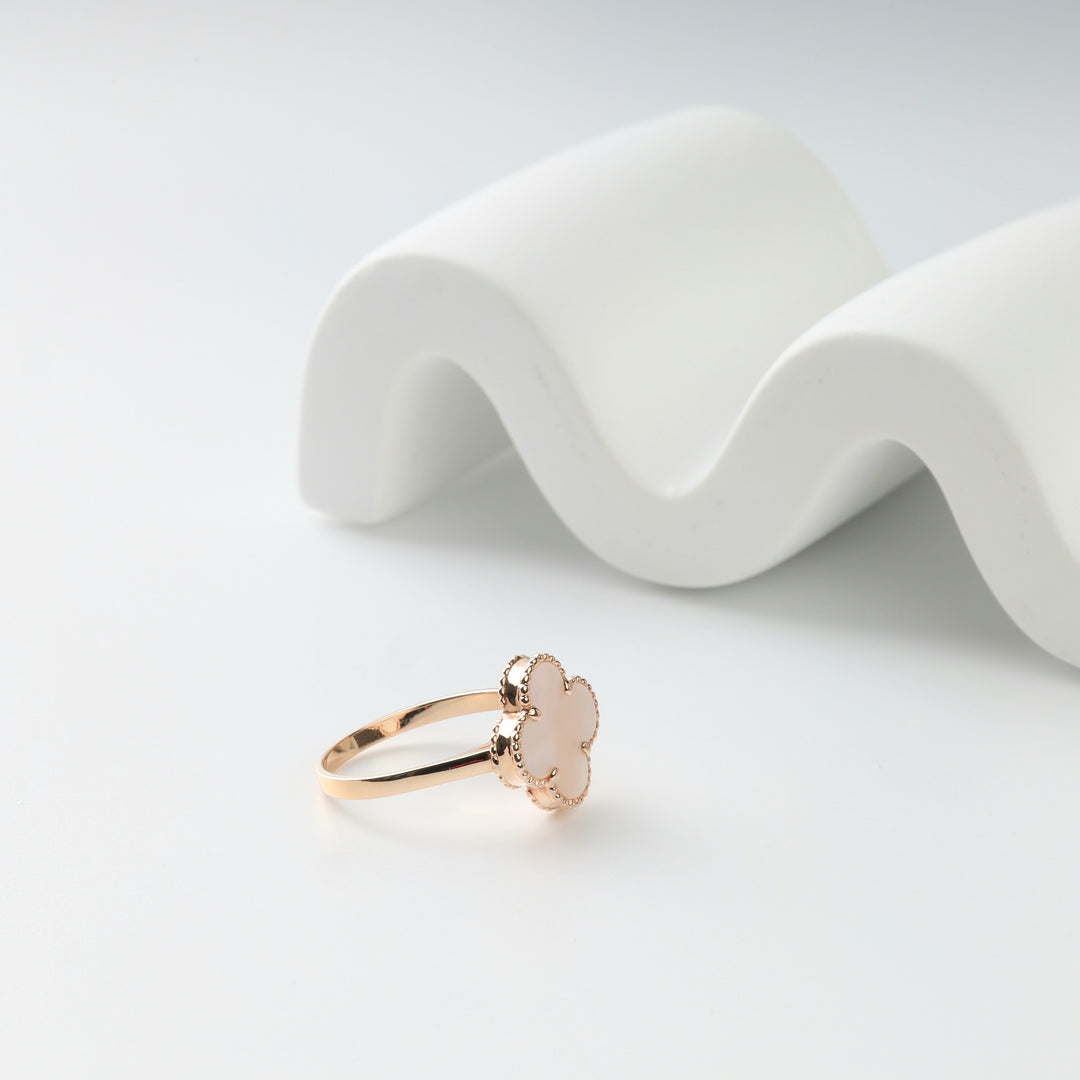 Side view of the mother-of-pearl clover ring and beaded setting