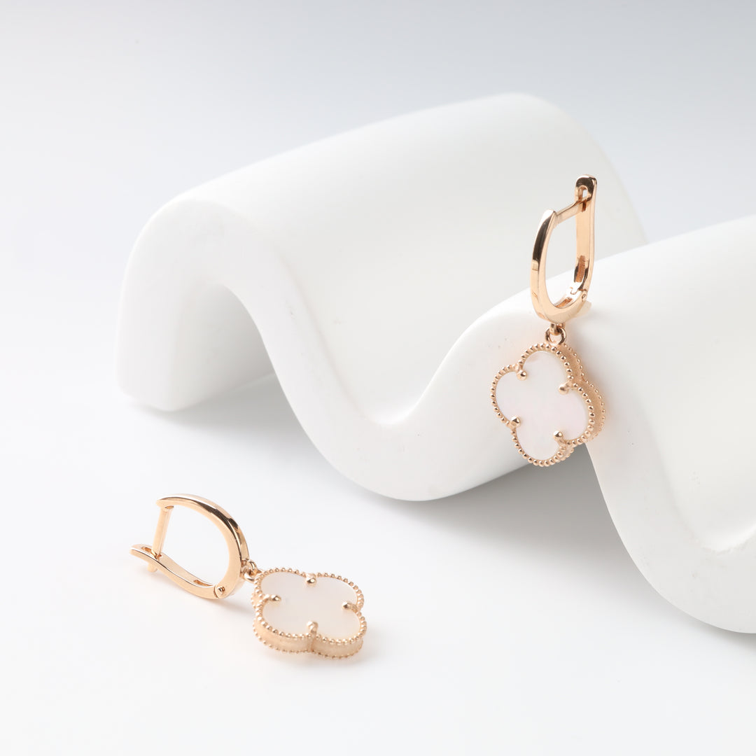 Close-up of the leverback and clover setting in 14K rose gold