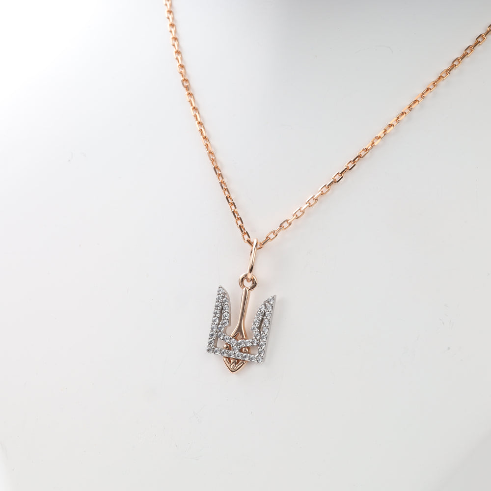 Ukrainian Tryzub gold pendant showing polished bail and stone-set frame