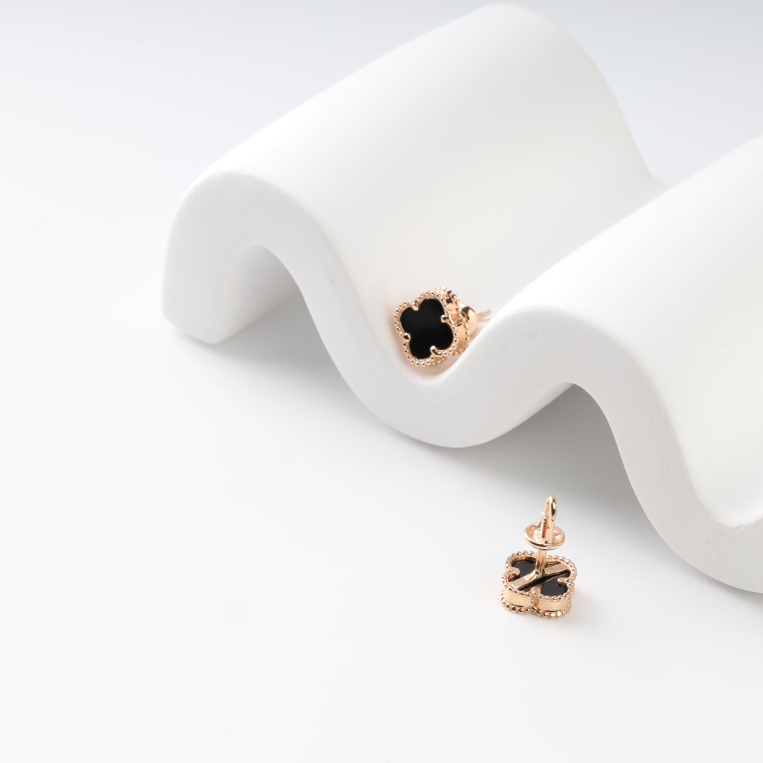 Black onyx screw-back stud earrings showing front and reverse