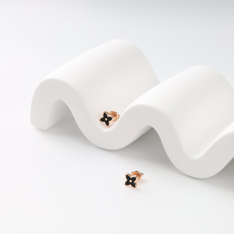 Black enamel four-petal stud earrings in 14K rose gold, front view