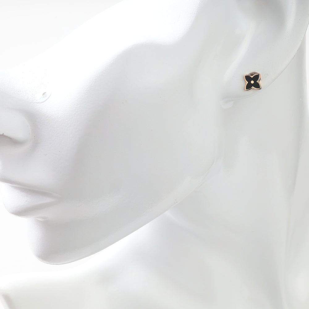 Black enamel rose gold stud earring shown on an ear
