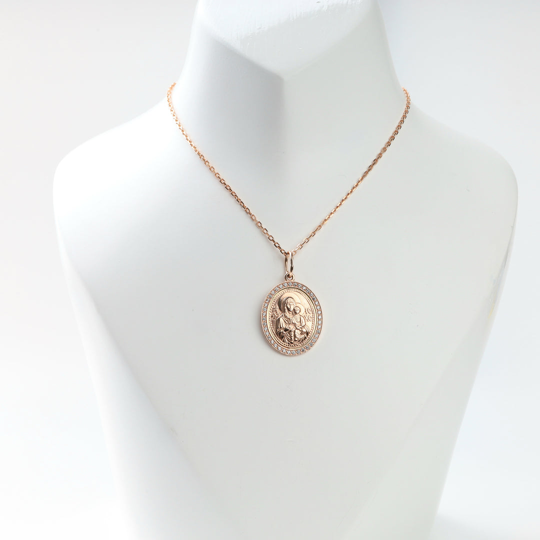 Oval Virgin Mary and Child rose gold pendant with clear stone border
