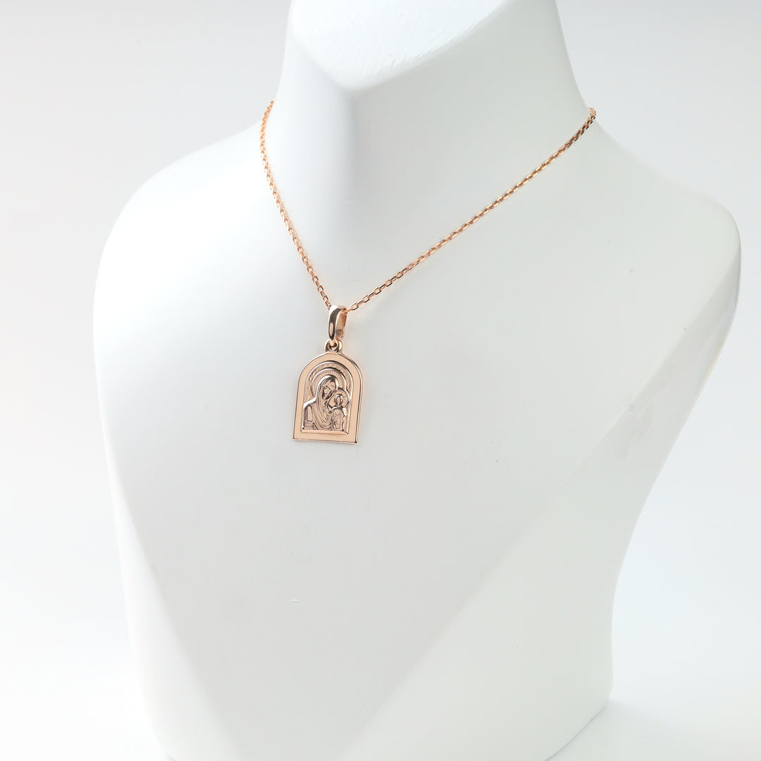 Ukrainian 585 gold religious icon pendant, angled display view