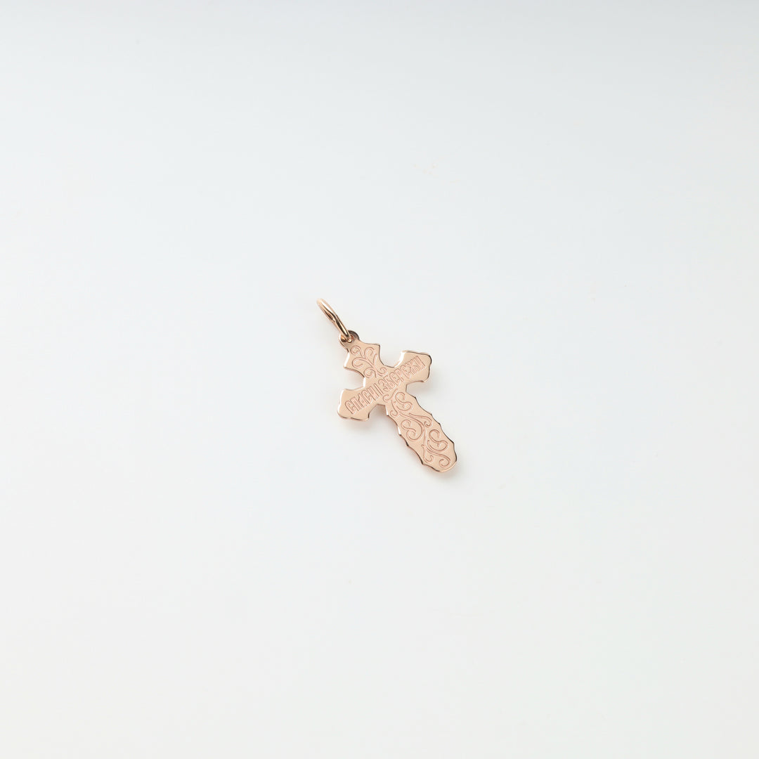 Ukrainian 585 gold crucifix pendant with sculpted rays, angled view