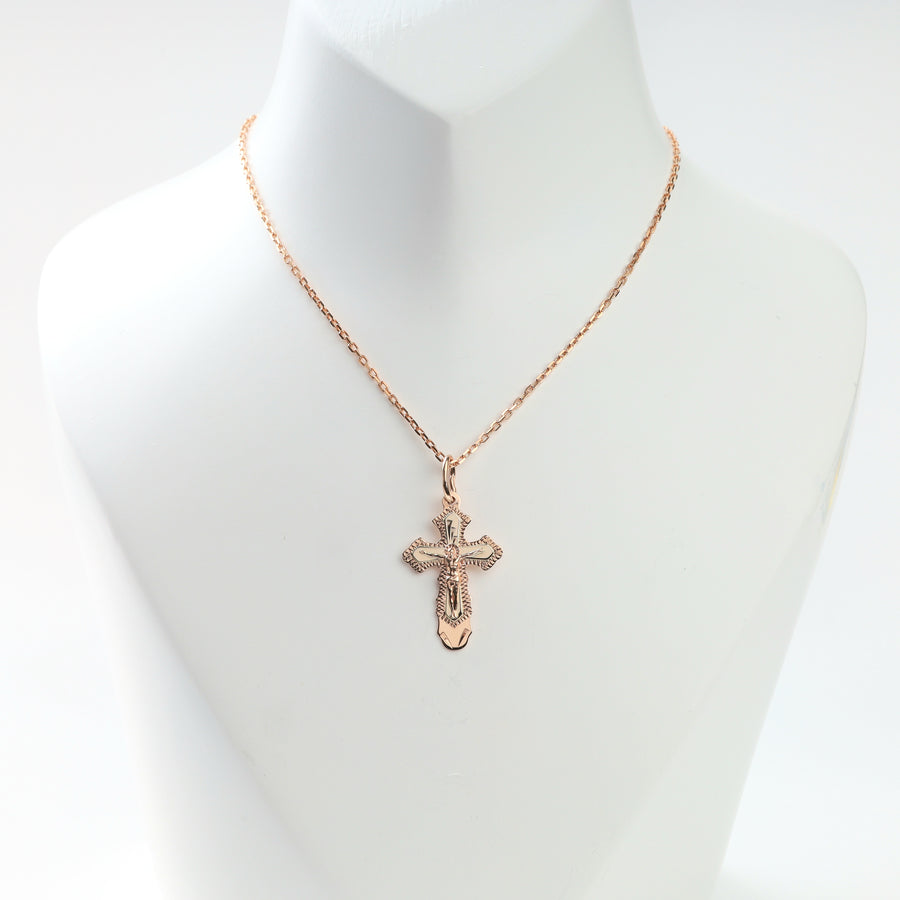 Reverse of ornate 14K gold crucifix cross pendant