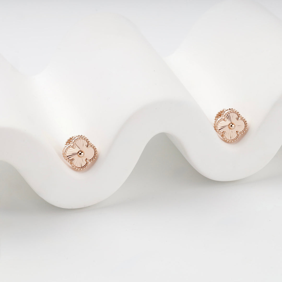 Rose gold clover stud earrings front view