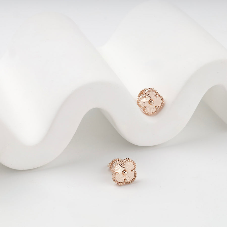 Rose gold clover stud earrings with beaded border, side view