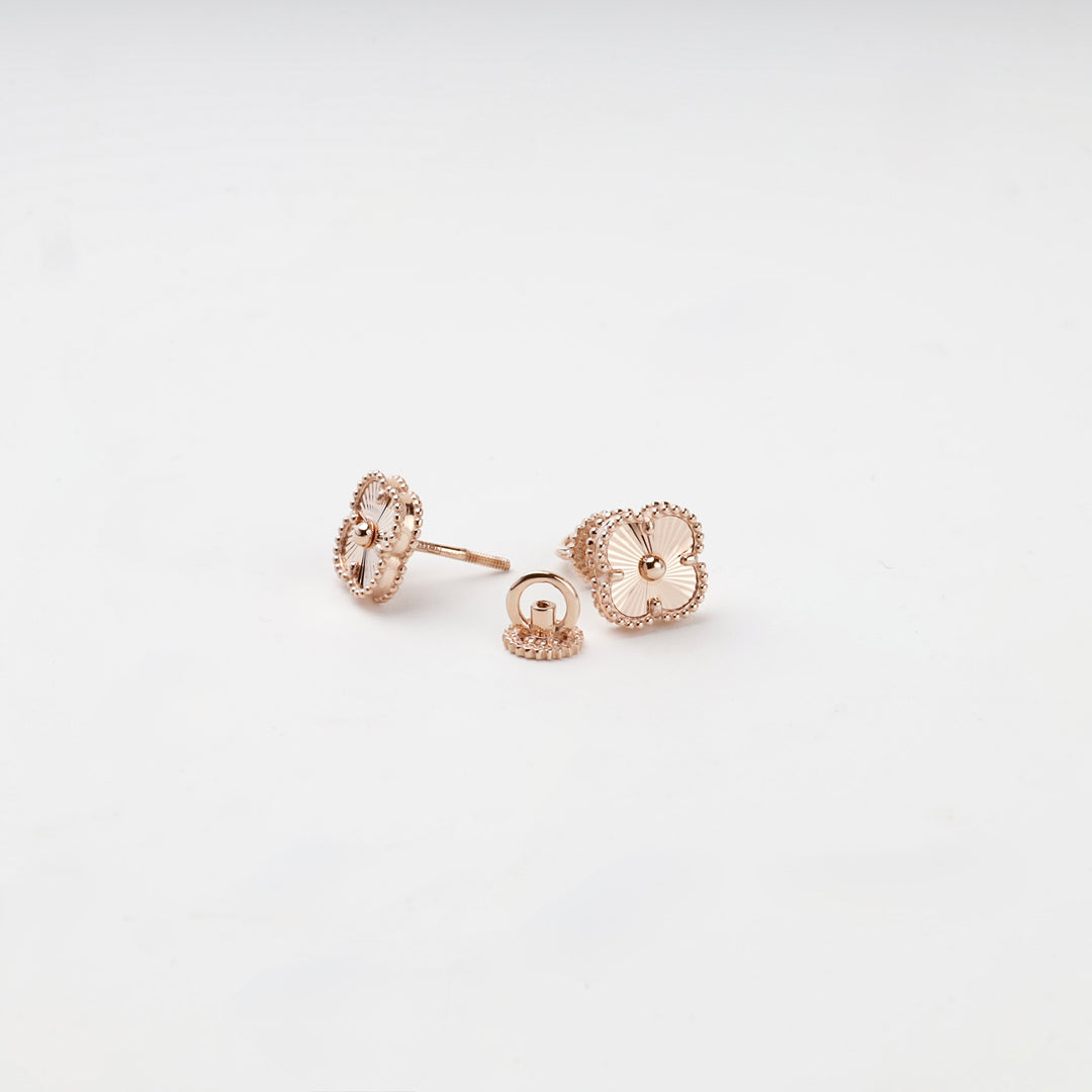Rose gold clover stud earrings with screw-back closure