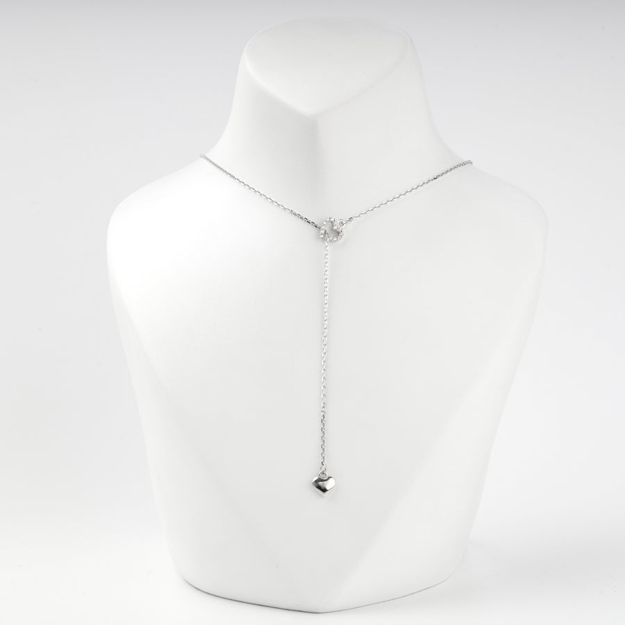 Silver 925 necklace with the chain running through the pave heart