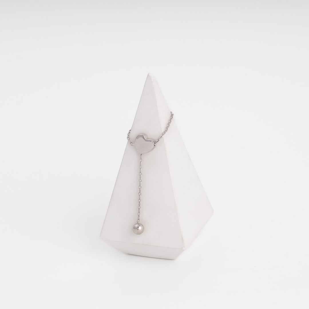 Silver heart ring with ball drop, flat lay — Ukrainian Jewelry