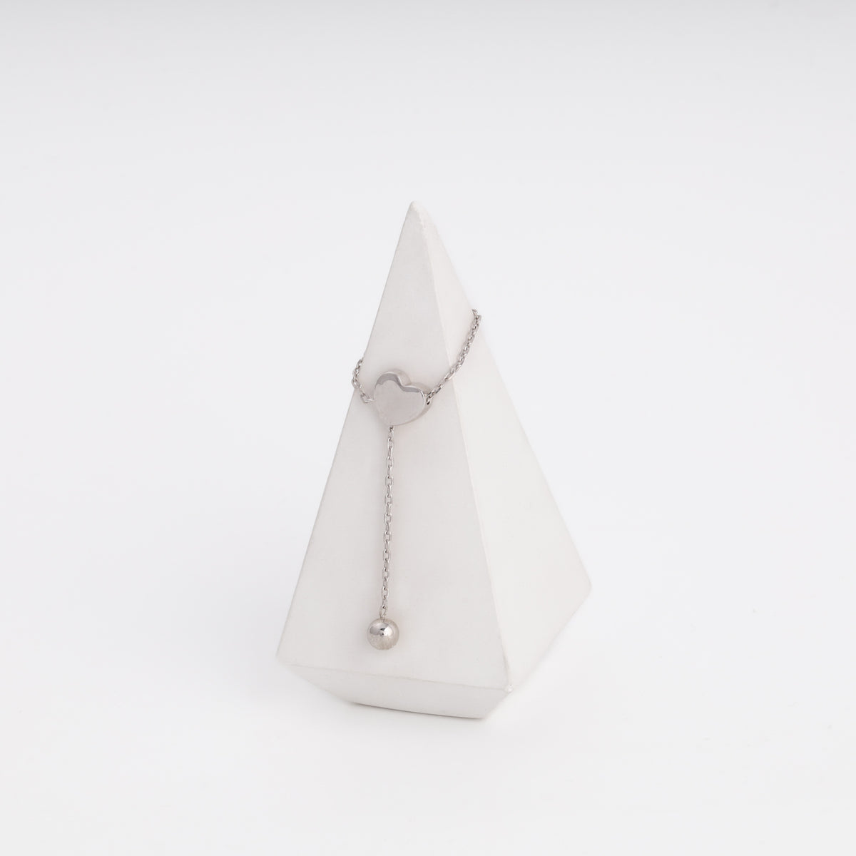 Silver heart ring with ball drop, flat lay — Ukrainian Jewelry