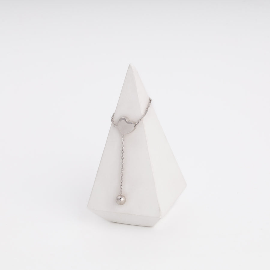 Silver heart ring with ball drop, flat lay — Ukrainian Jewelry