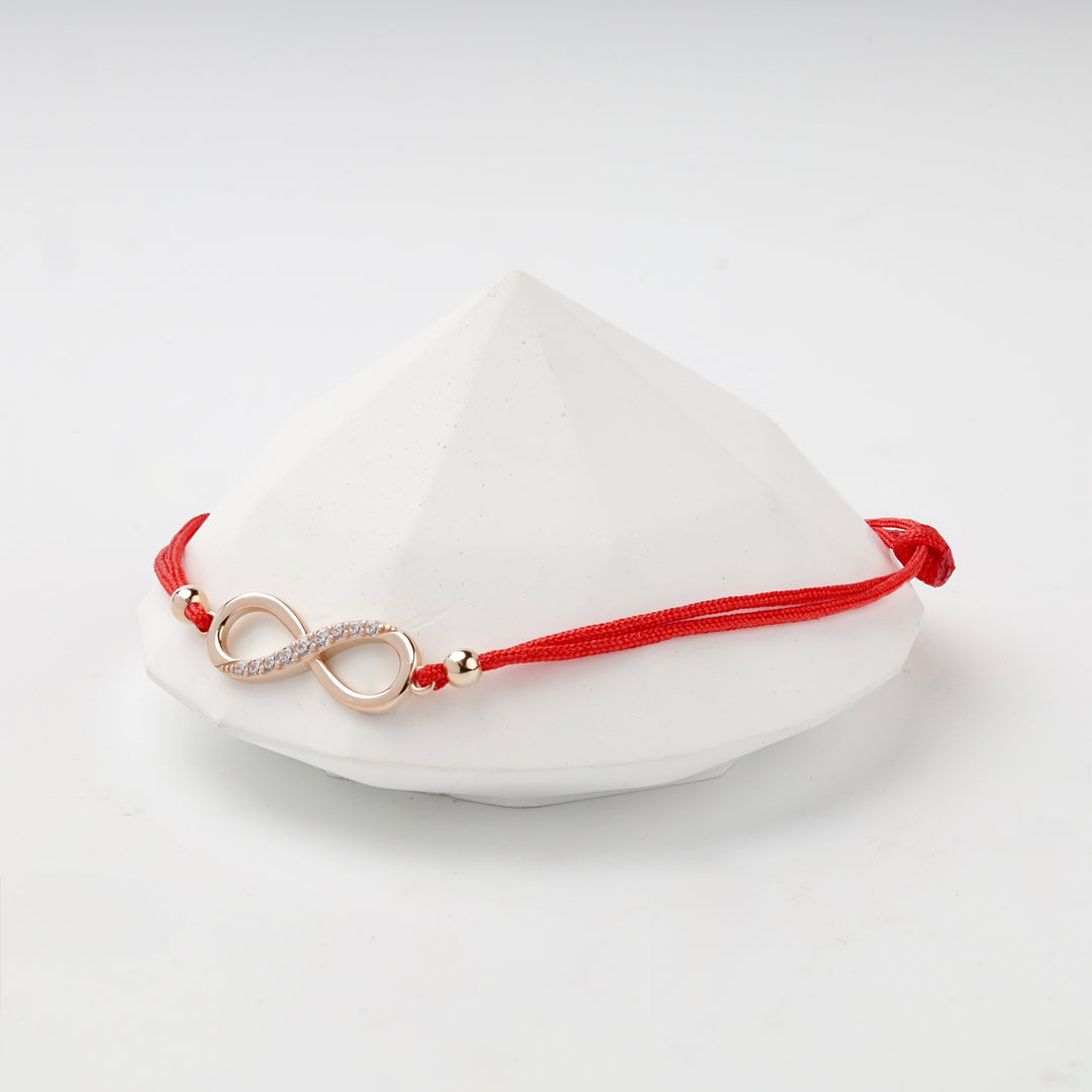 Red Cord Infinity Bracelet with Cubic Zirconia | 14K Rose Gold (585) — scale view