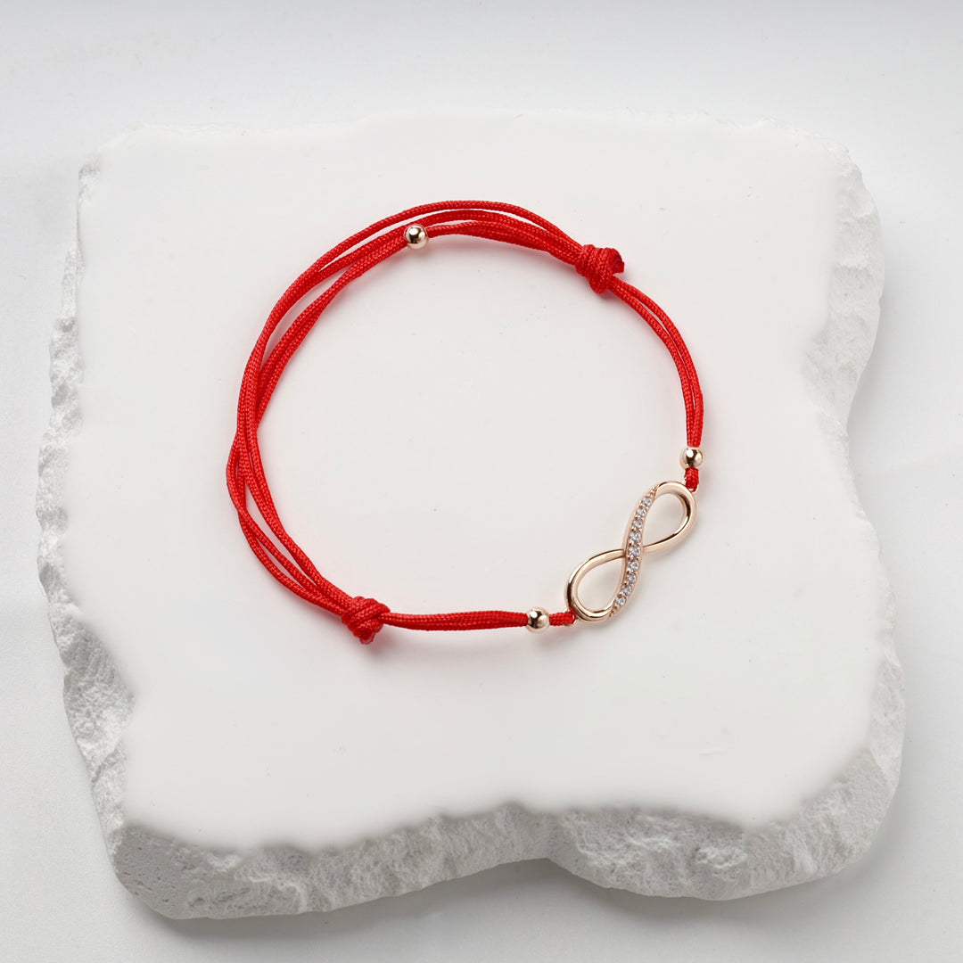 Red Cord Infinity Bracelet with Cubic Zirconia | 14K Rose Gold (585) — profile view
