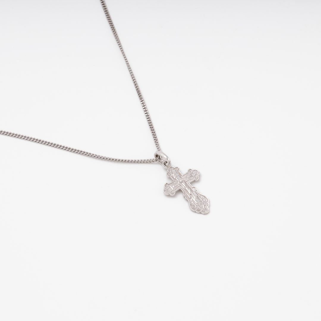 Silver Orthodox cross pendant front view, Crucifix figure, ornate borders — Ukrainian Jewelry