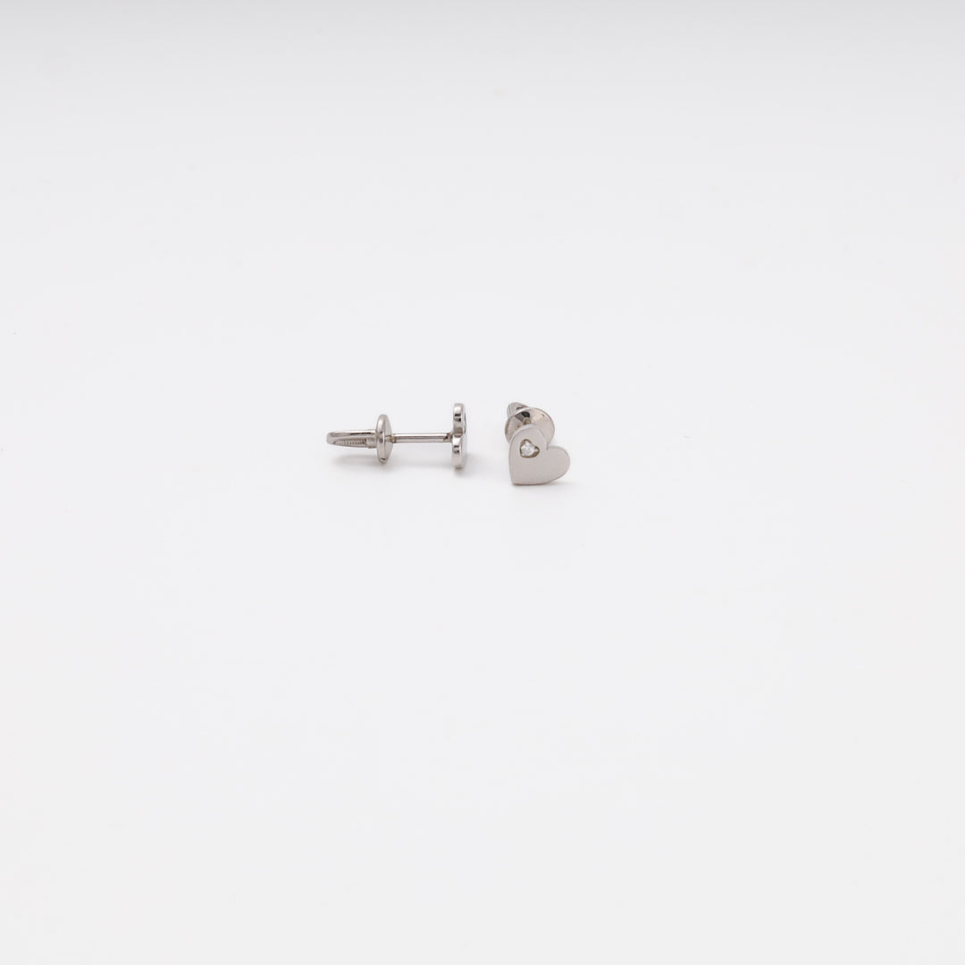 Heart stud earrings close-up on stand, rhodium plated silver — Ukrainian Jewelry