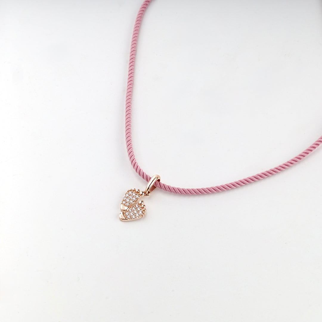 Rose gold baby feet keepsake pendant, studio view