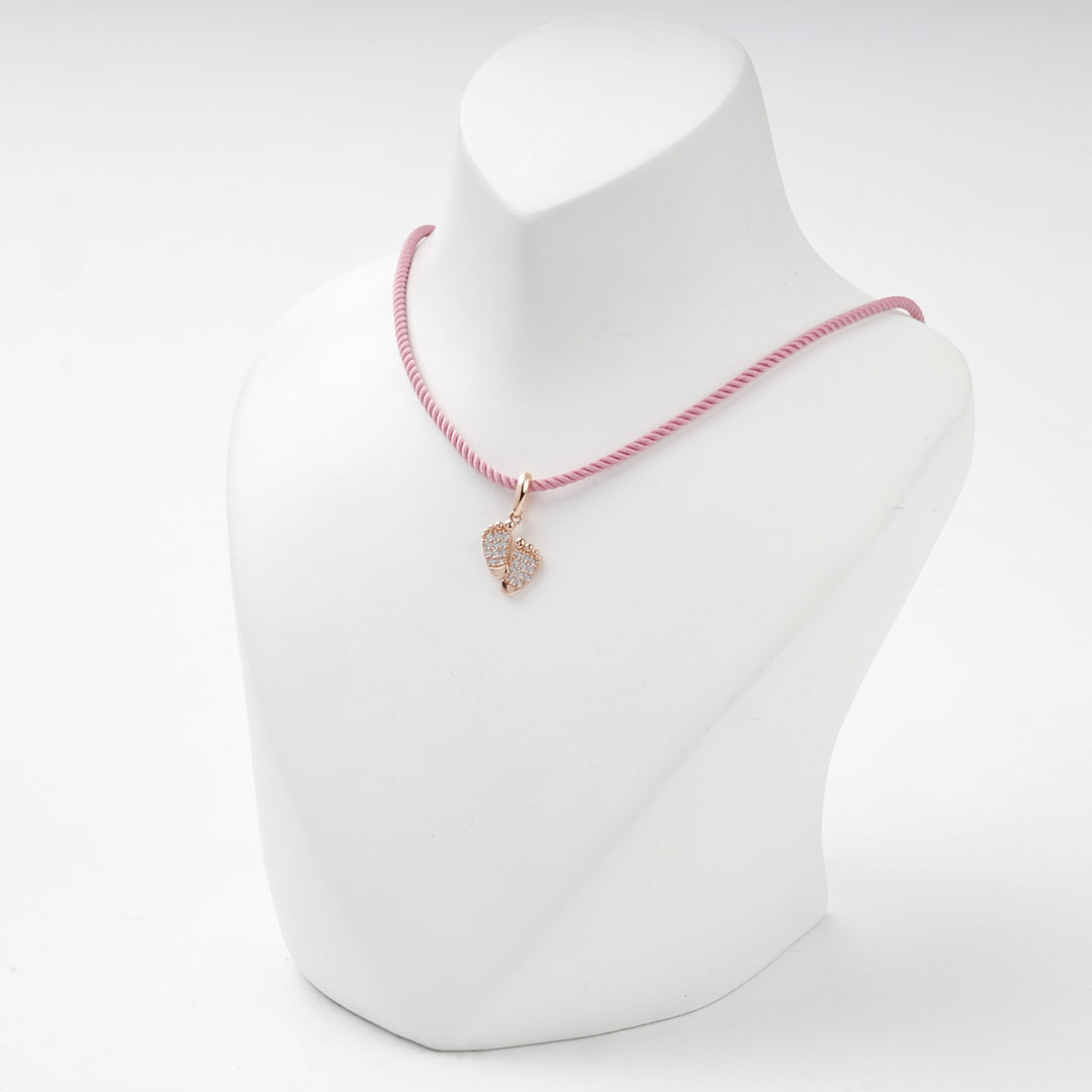 Rose gold baby feet pendant with cubic zirconia, side view